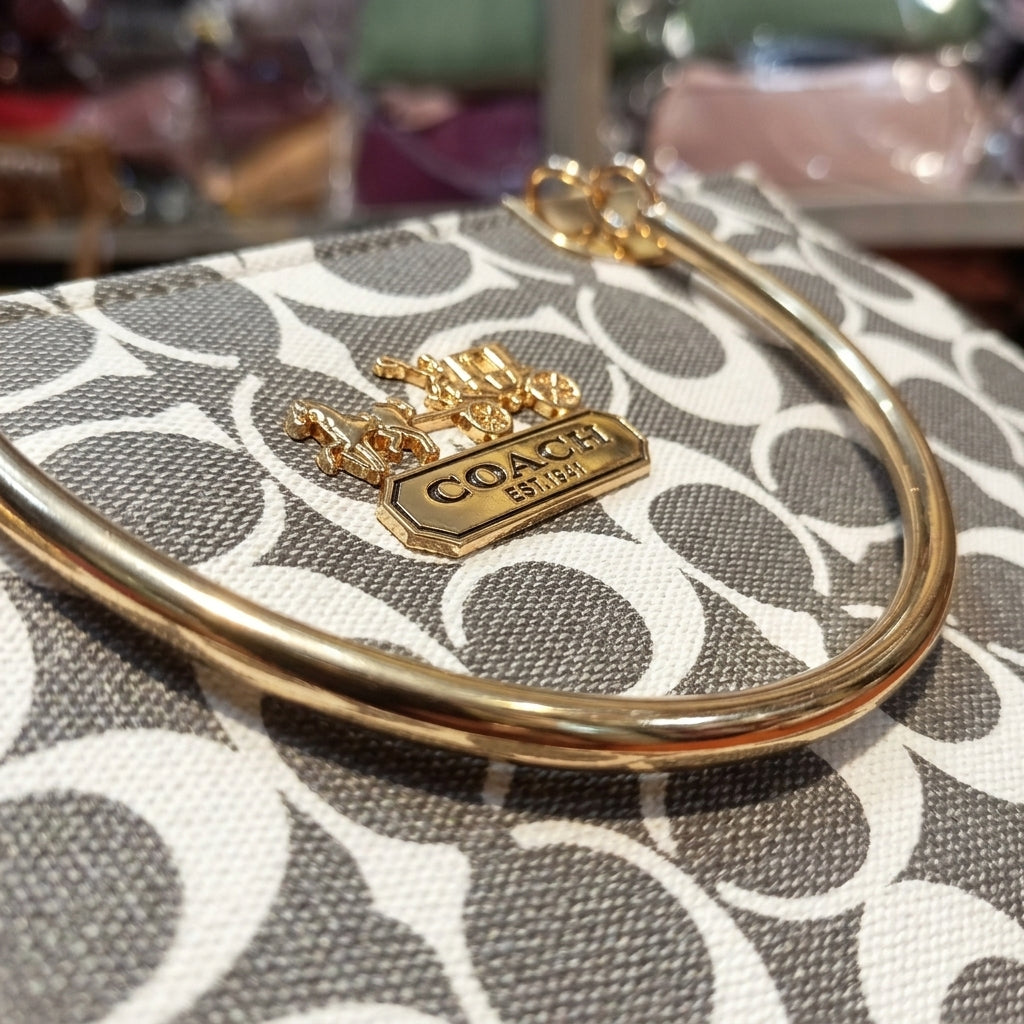 Elegant Grey Monogram Handbag with Gold Handle